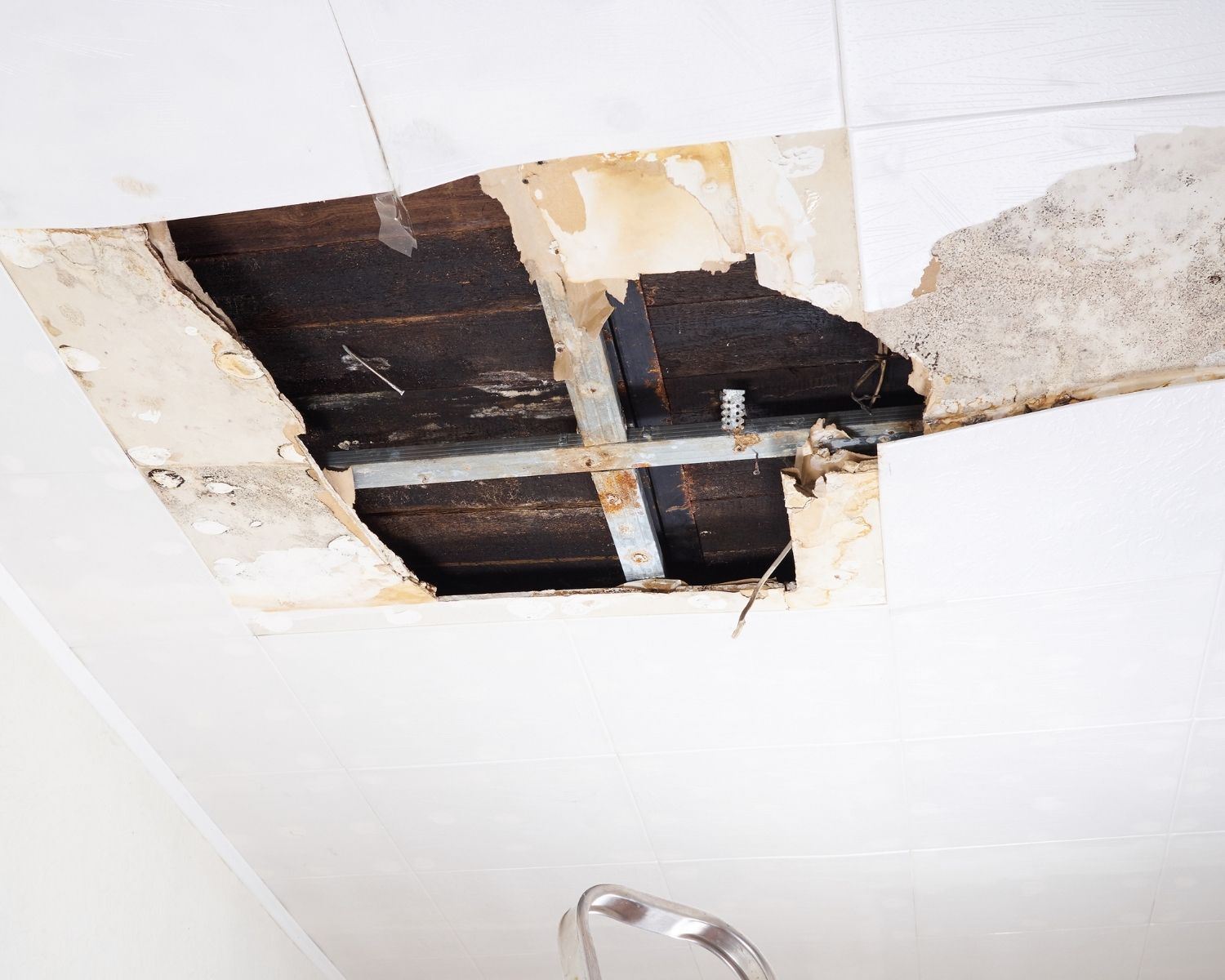 Water damaged ceiling showing visible water stains and damage