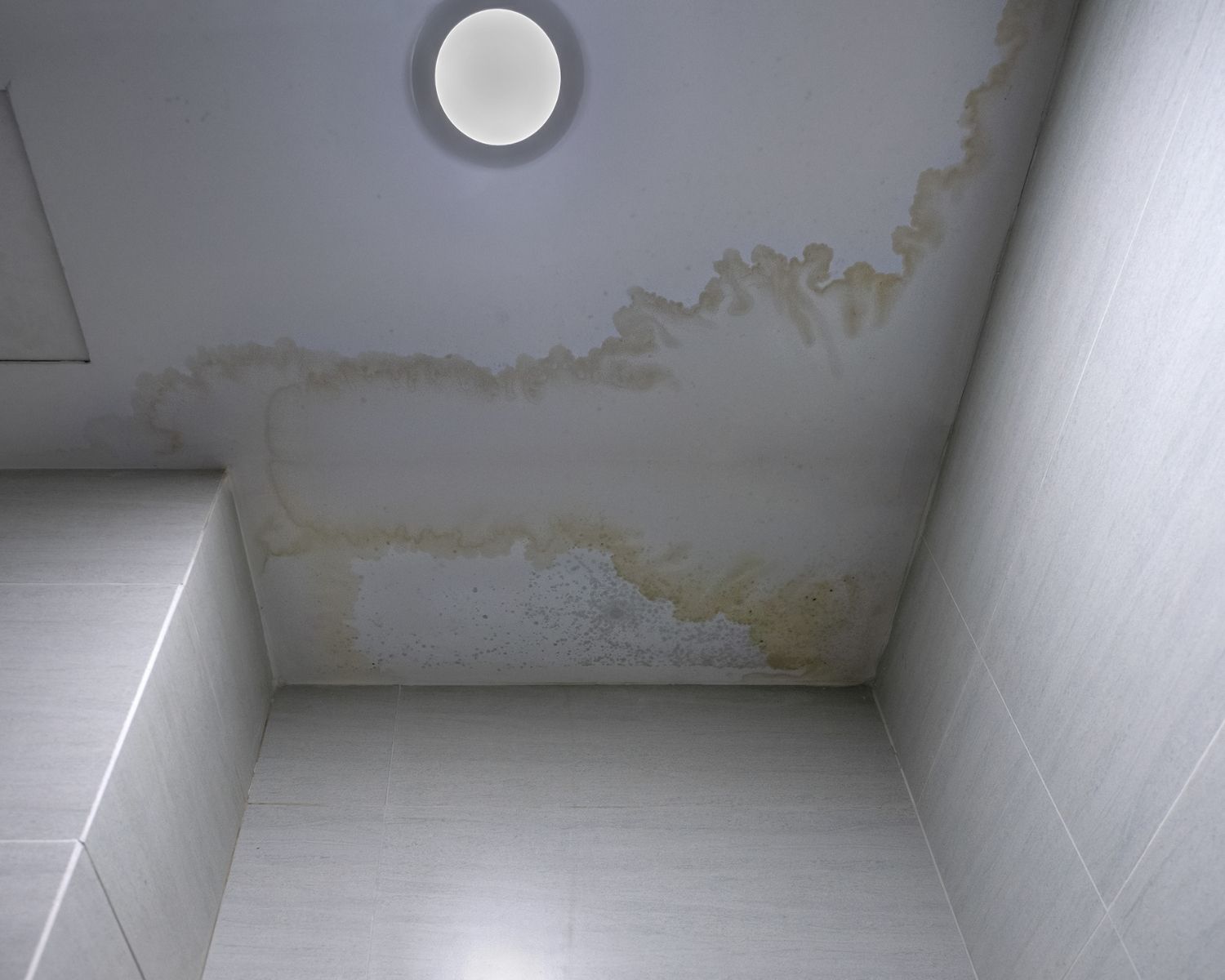 Ceiling water damage stain from spring thaw leak
