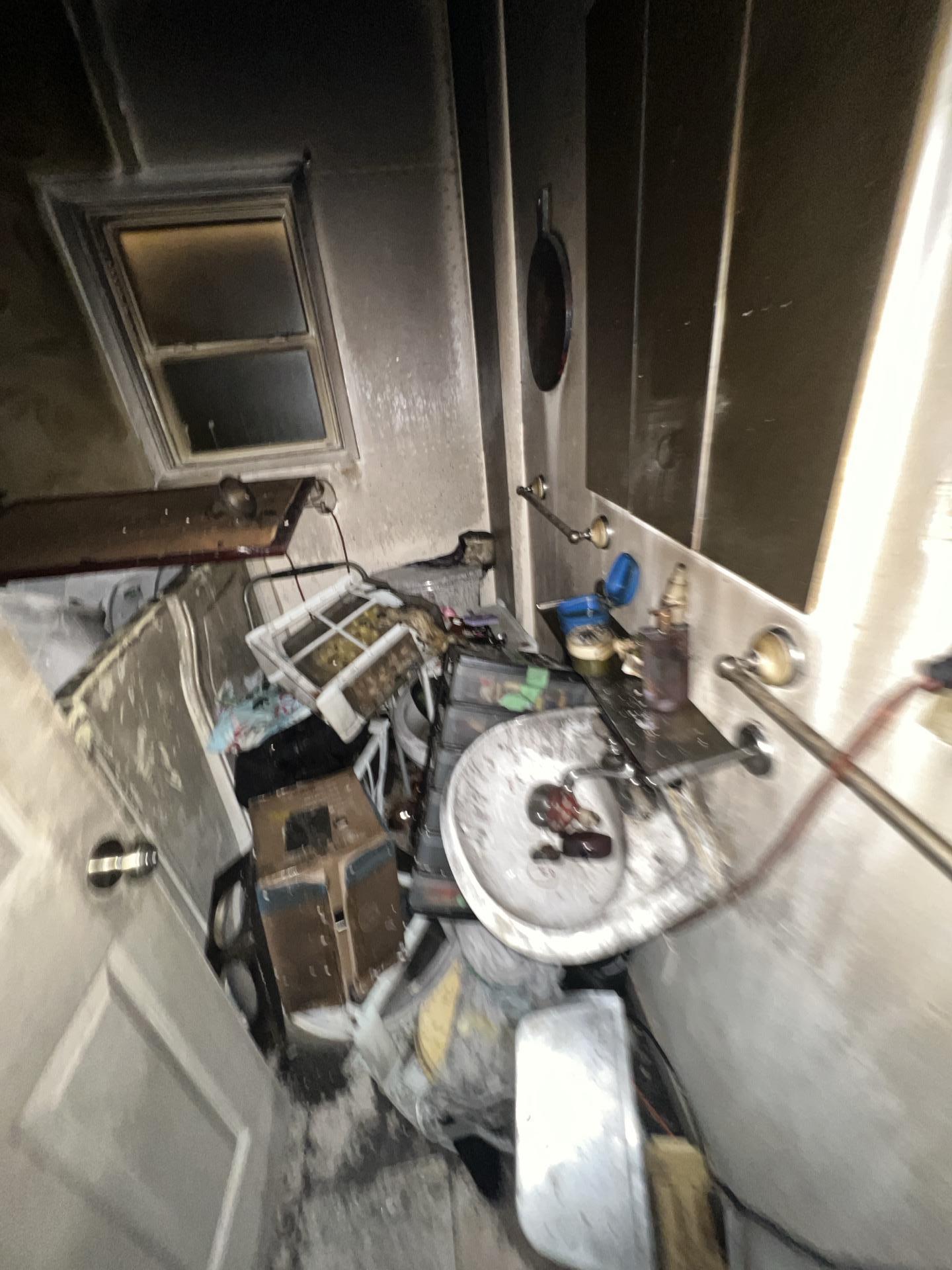 Smoke damage coating bathroom walls and fixtures after an electrical house fire in Everett WA