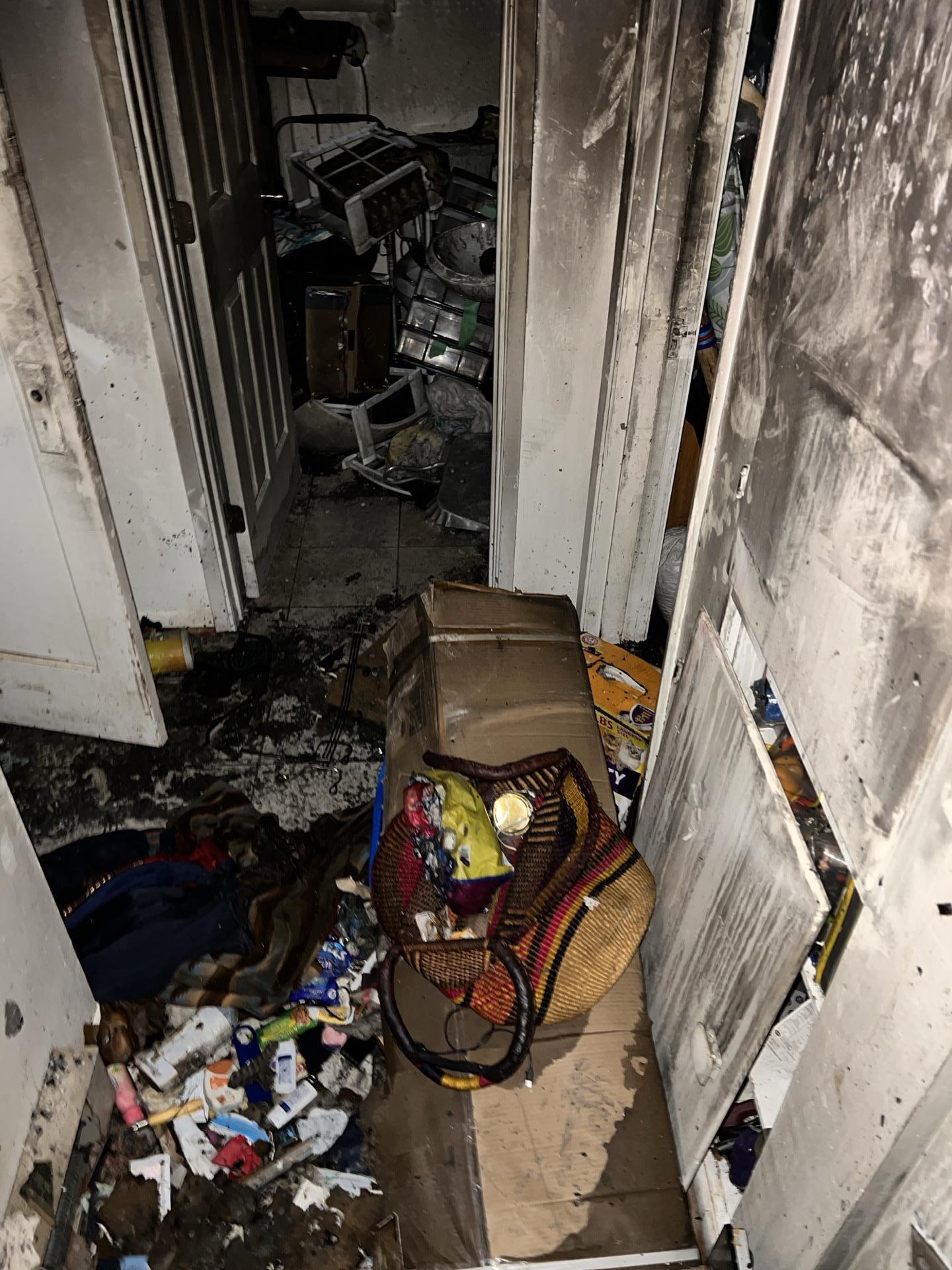 Soot contamination visible on interior doors and hallway walls in fire-damaged Everett home