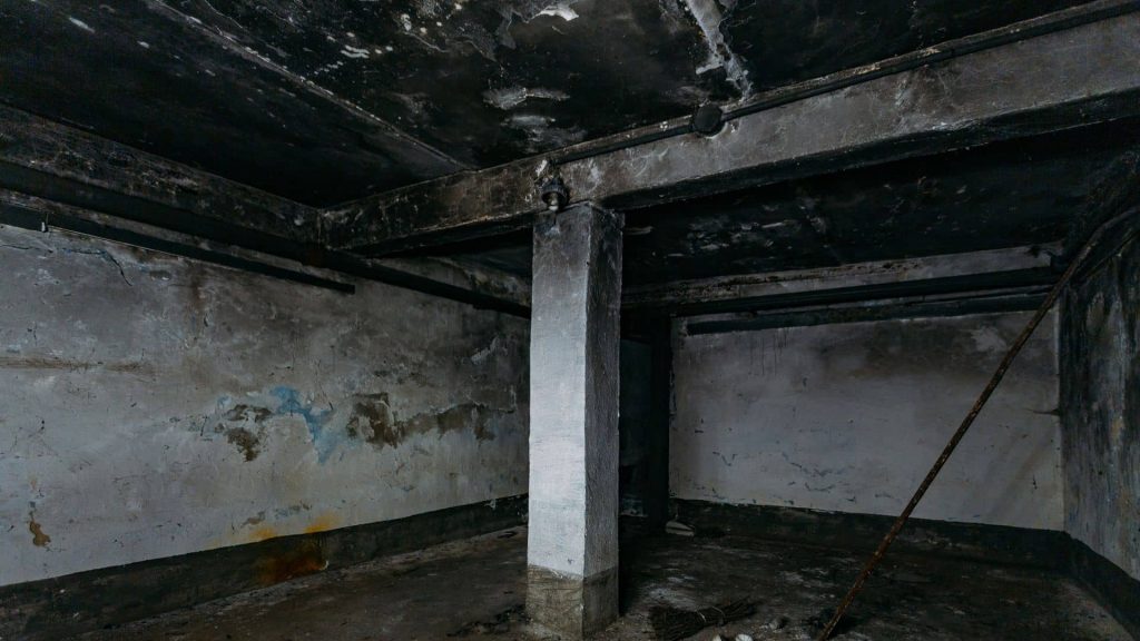 Clyde Hill home interior with soot residue on ceiling, wall art outlines, and smoke-affected furnishings