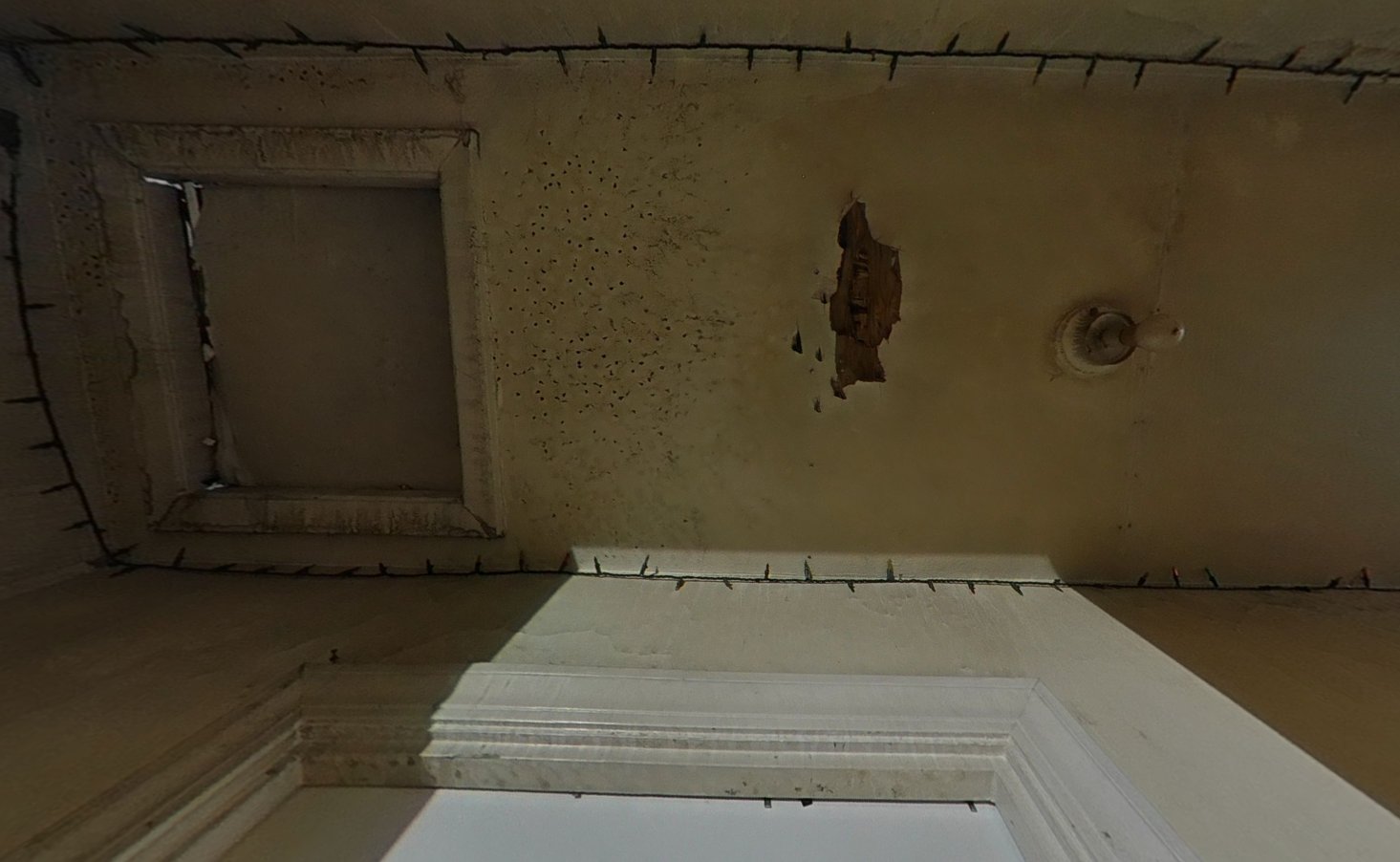 Closeup of hallway ceiling smoke staining and soot damage