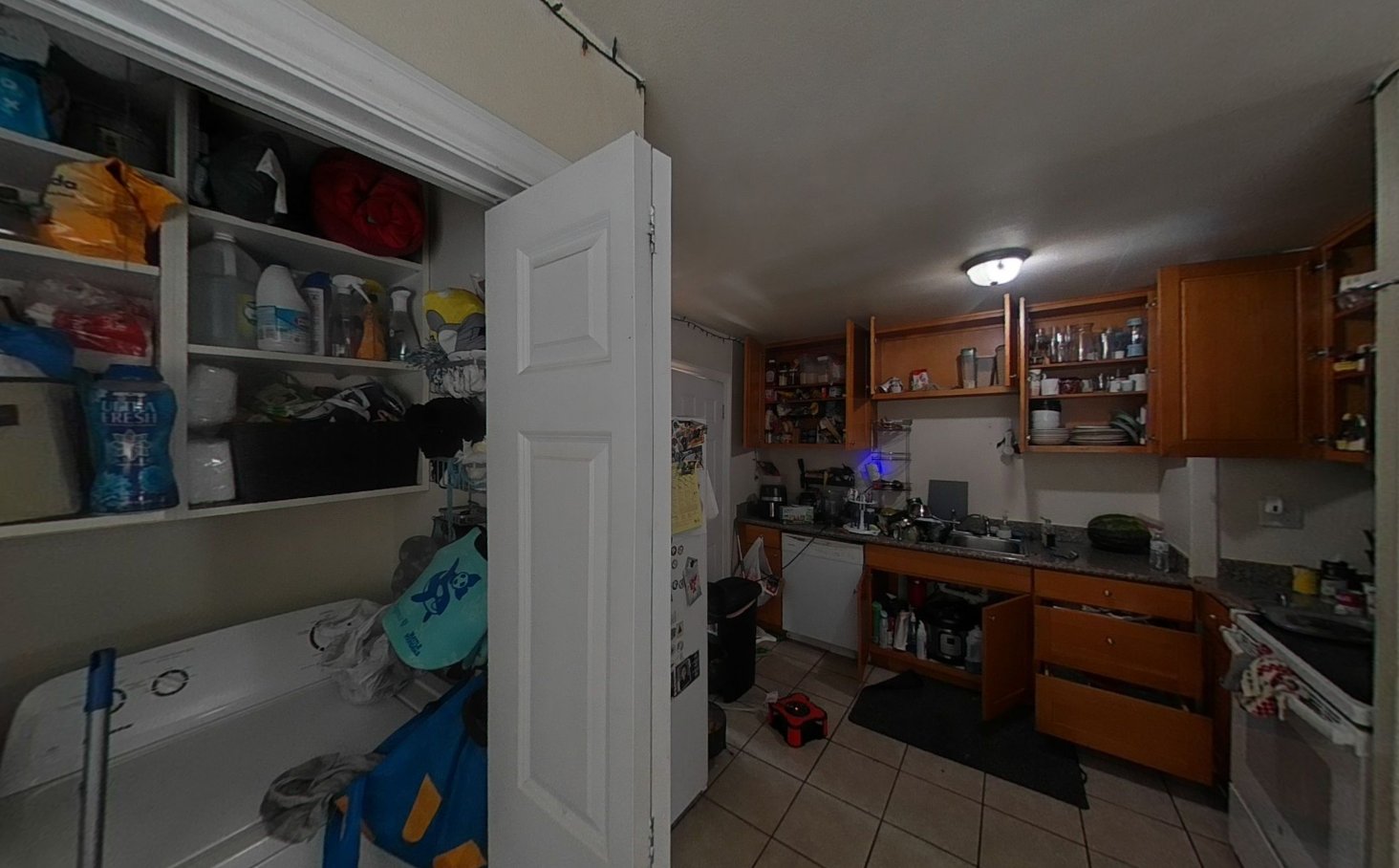 Kitchen and laundry area with smoke and heat damage