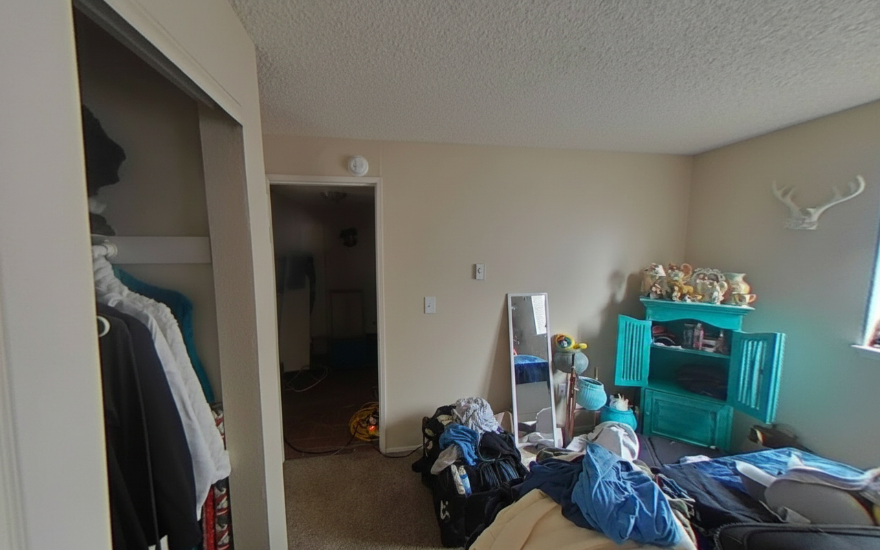 Bedroom with restoration equipment placed after extensive explosion and fire related damage