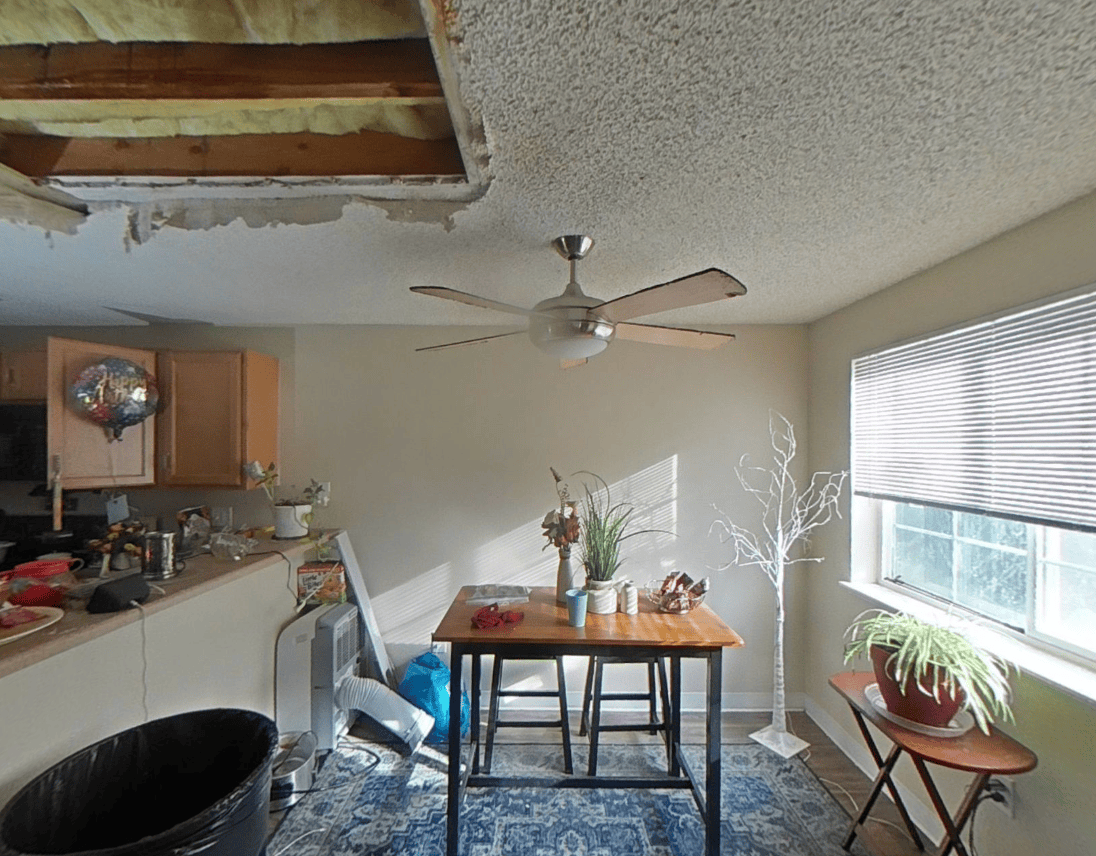 Collapsed ceiling above the dining area after an explosion in the unit above