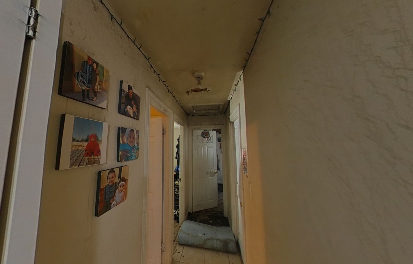Hallway with smoke damage and soot-stained walls and ceiling
