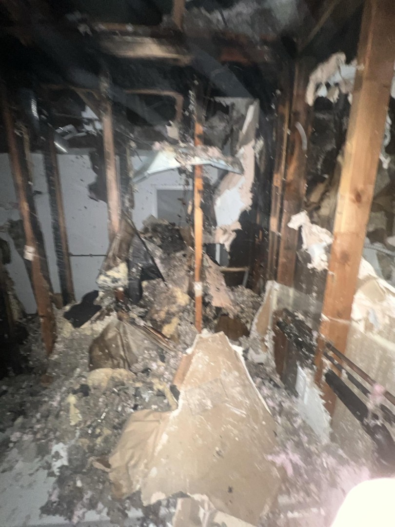 Initial fire damage assessment in a Woodinville WA living area after a dryer vent fire