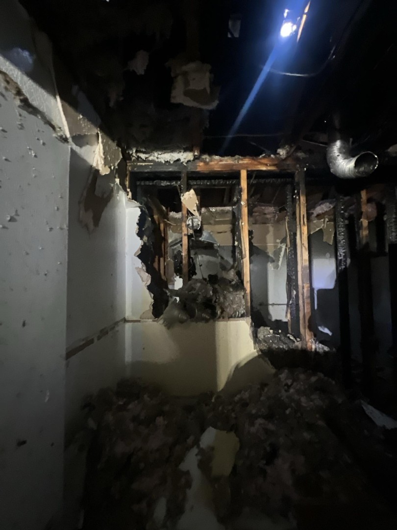 Ceiling burn damage with exposed joists after a residential fire in Woodinville WA
