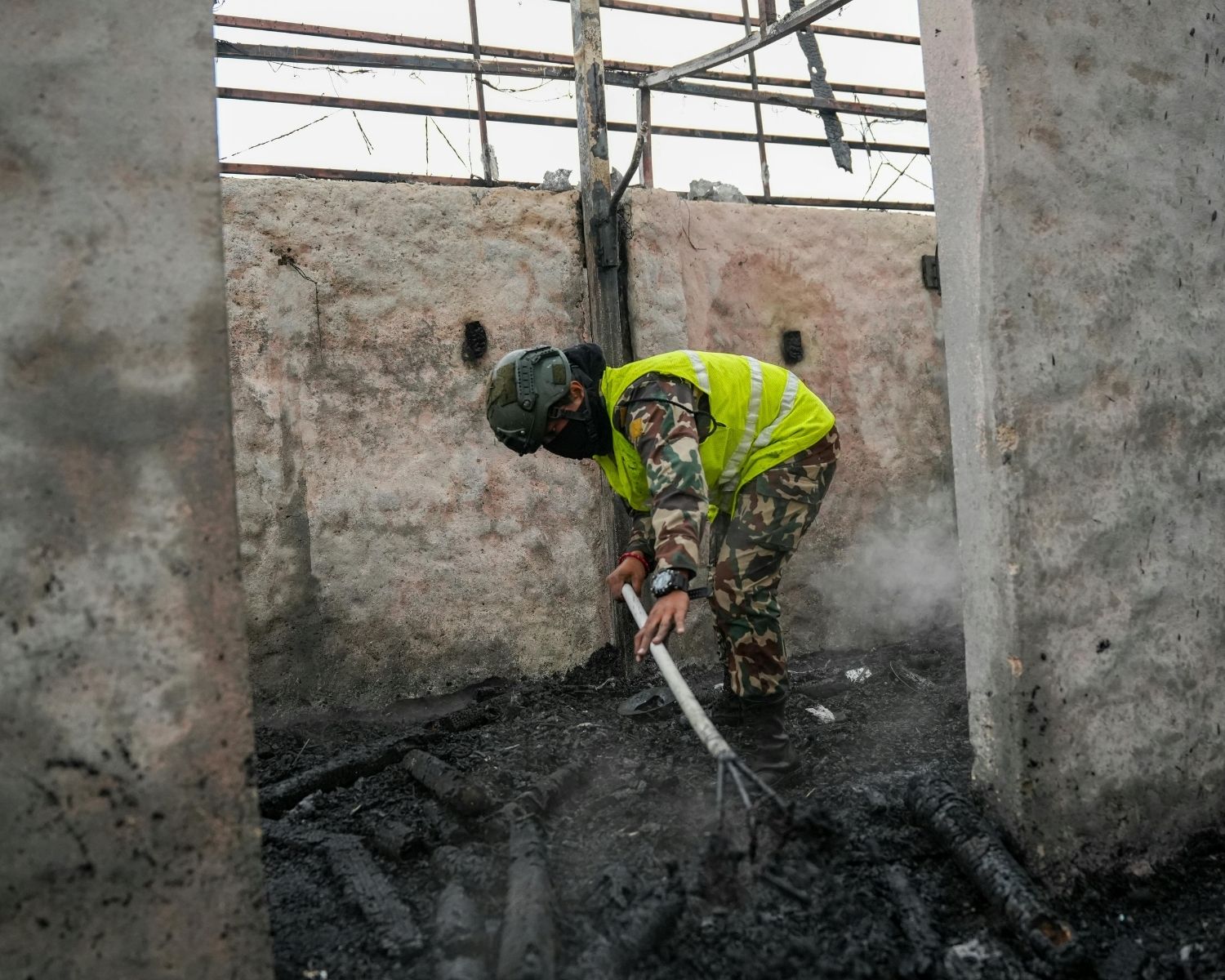IICRC-certified restoration technician inspecting fire and smoke damage in a residential home