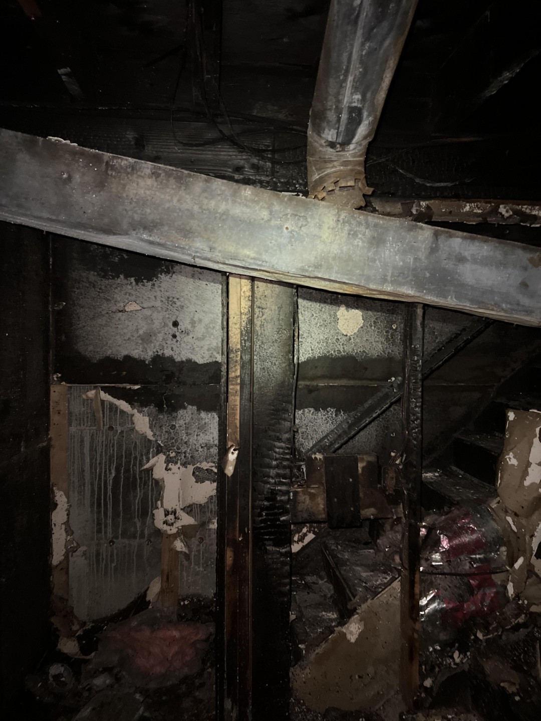 Charred structural framing exposed after a residential fire in Lynnwood, WA