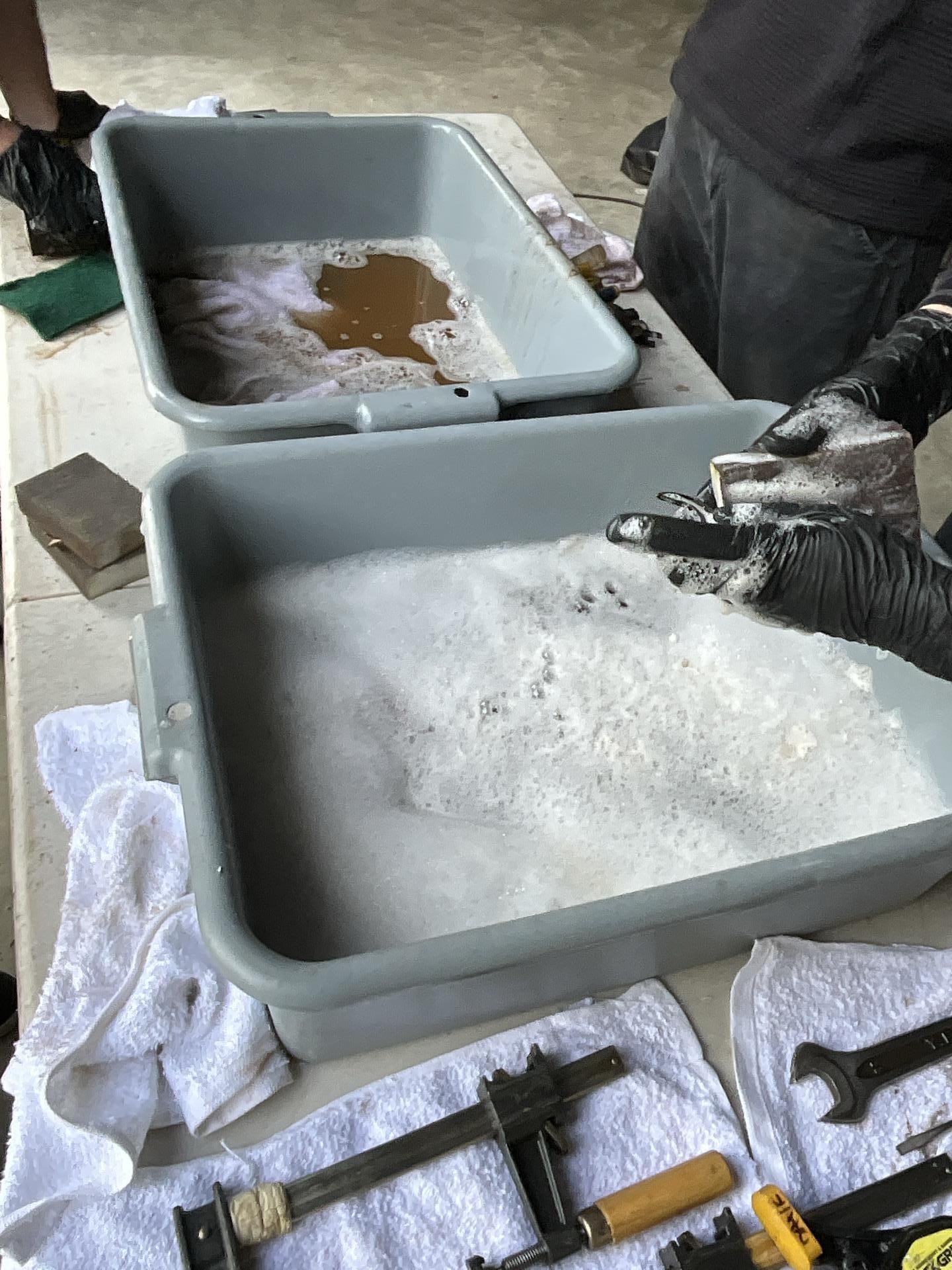 Immersion cleaning of smoke damaged hardware and hand tools at a contents cleaning station in Seattle WA