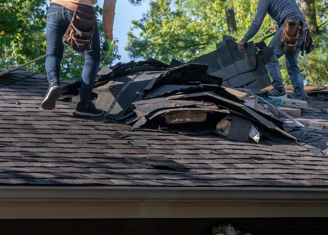 professionals repairing a roof