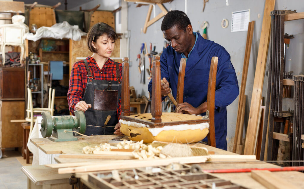 professional furniture restorers restoring a furniture after water damage