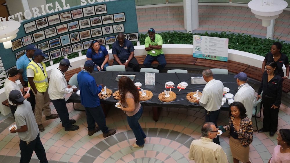 Workers from the City of Tamarac line up to indulge in some cookies offered by PuroClean on Labor Day