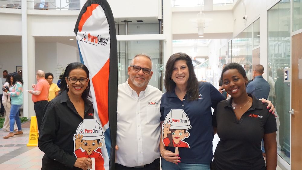 Our crew poses at the Tamarac City town center during the cookie sharing event on Labor Day