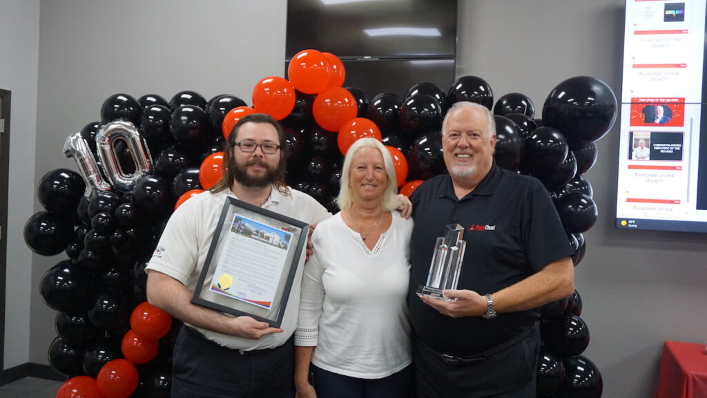 Steve White celebrating his anniversary alongside his son and wife.