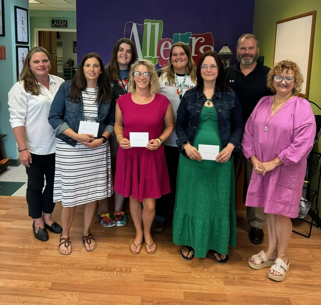 group of teachers after receiving supplies and funds from PuroClean's Adopt a Classroom campaign