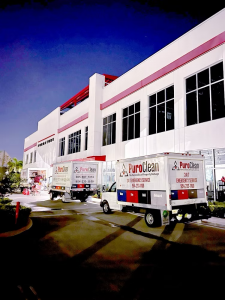 PuroClean trucks helping out at a local facility for disaster recovery as featured in Miami living magazine