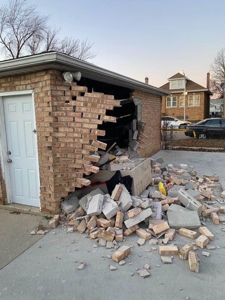 Damage to garage from car smashing into it.