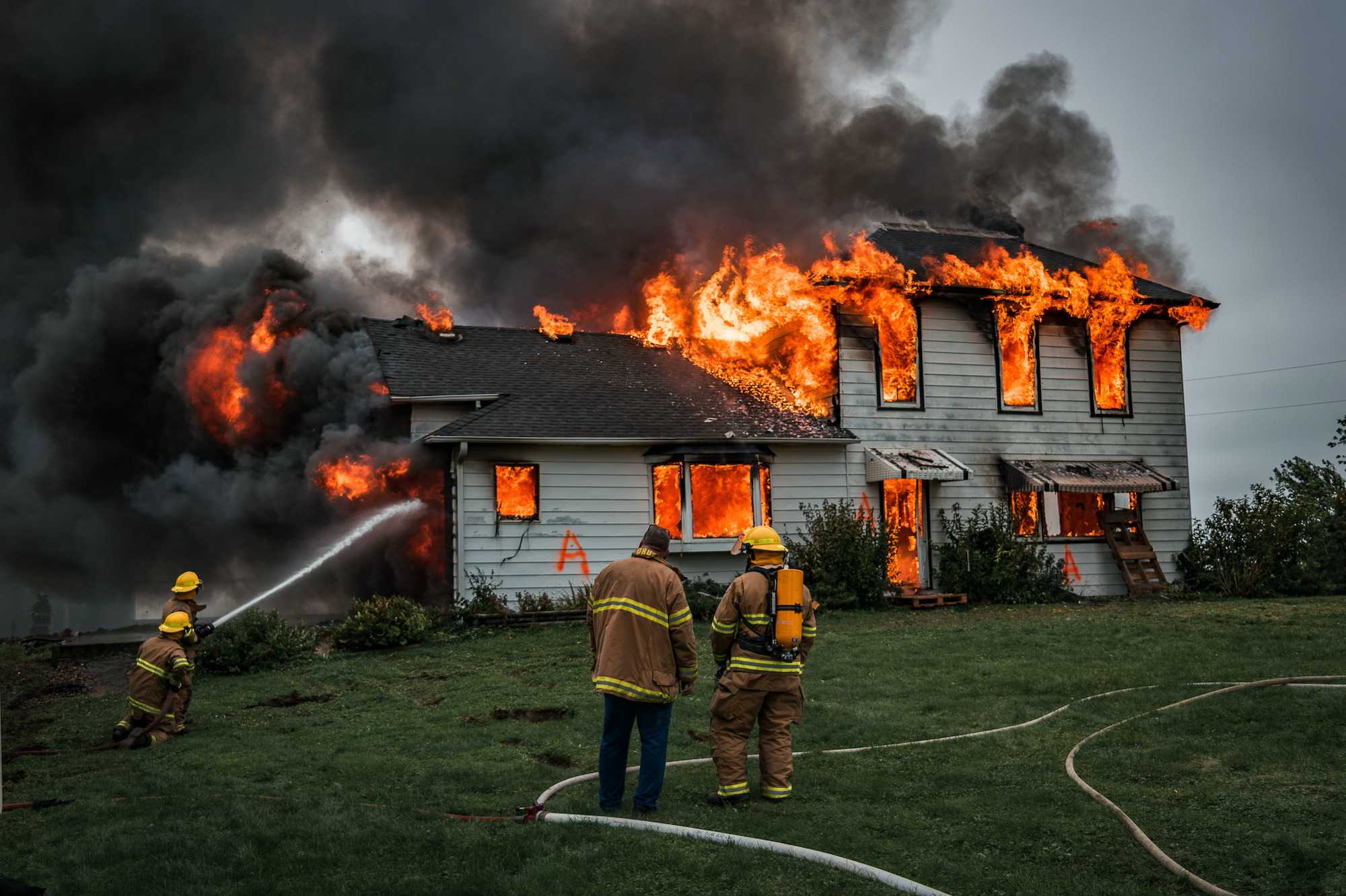 fire fighters helps to calm the fire